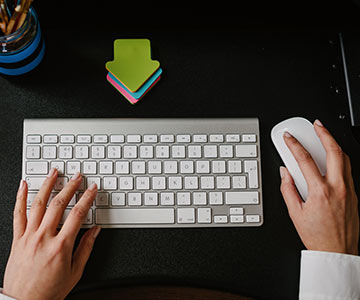 Hands using keyboard and mouse