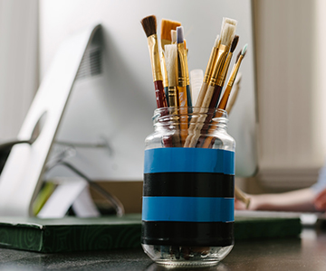 Jar of paint brushes